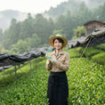 Load image into Gallery viewer, A young Japanese woman in the Uji matcha fields holds a Wayne Raven matcha bar 
