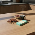 Load image into Gallery viewer, 41% Milk Chocolate bar on a coffee table with a hot cup of drinking chocolate
